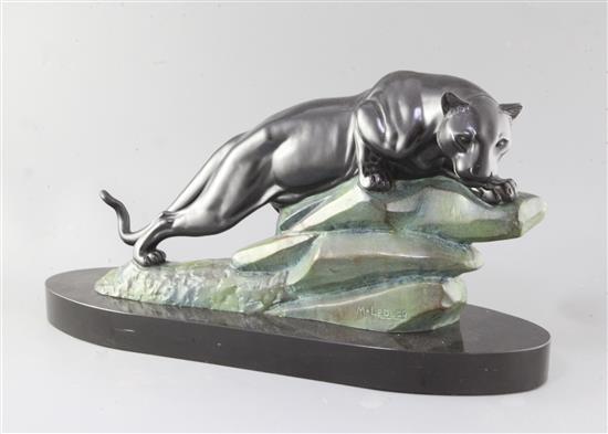 M. LeDucq. An Art Deco patinated spelter model of a panther upon a rock, 23in.